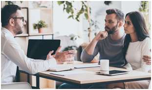 Married Couple Discussing Life Insurance with Professional Advisor